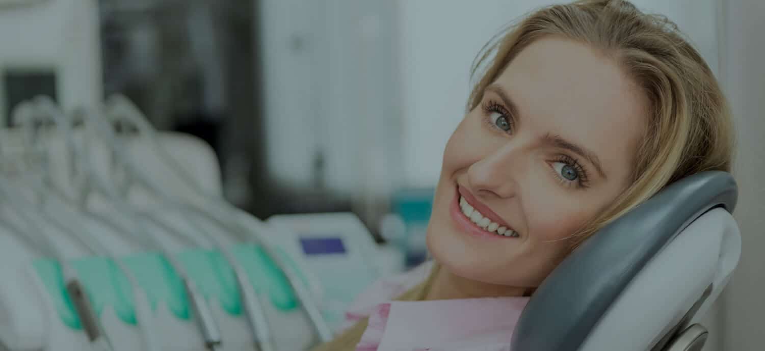 Young woman utilizes the types of teeth cleaning and its effect.